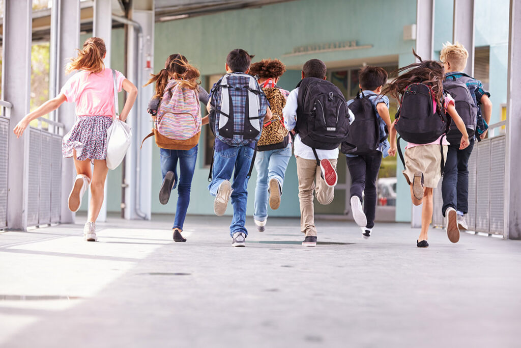 Photo of kids running to school