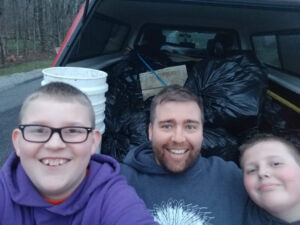 Jamie Jones with sons after picking up trash on the streets for Boy Scouts