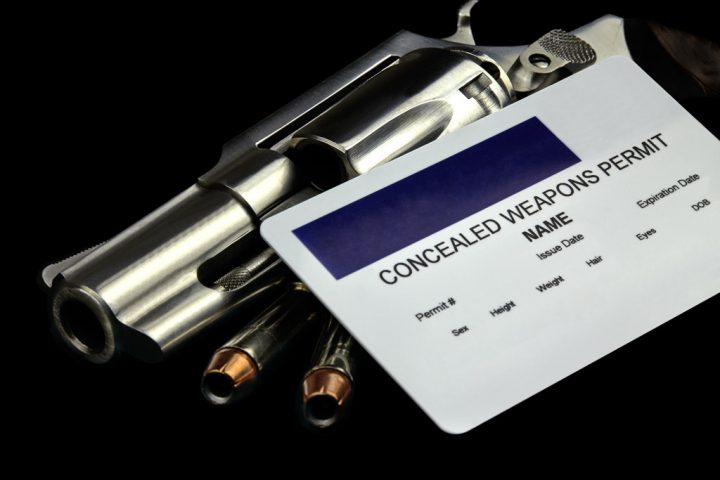 Concealed Weapons permit card and on top of a revolver.