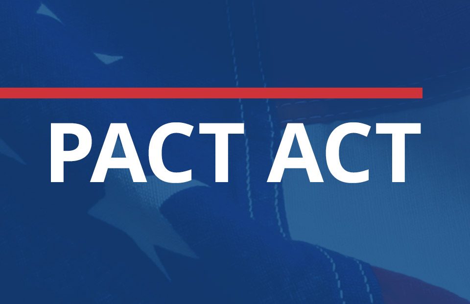 PACT ACT text overtop American flag